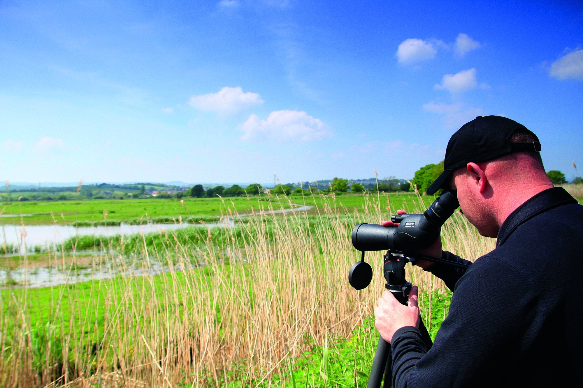 Man using Opticron spotting scope