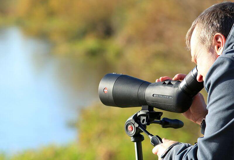 Man using spotting scope