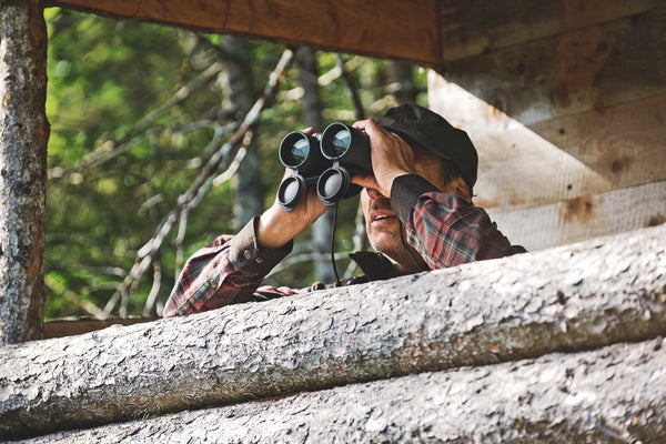 Man with binoculars from viewing platform
