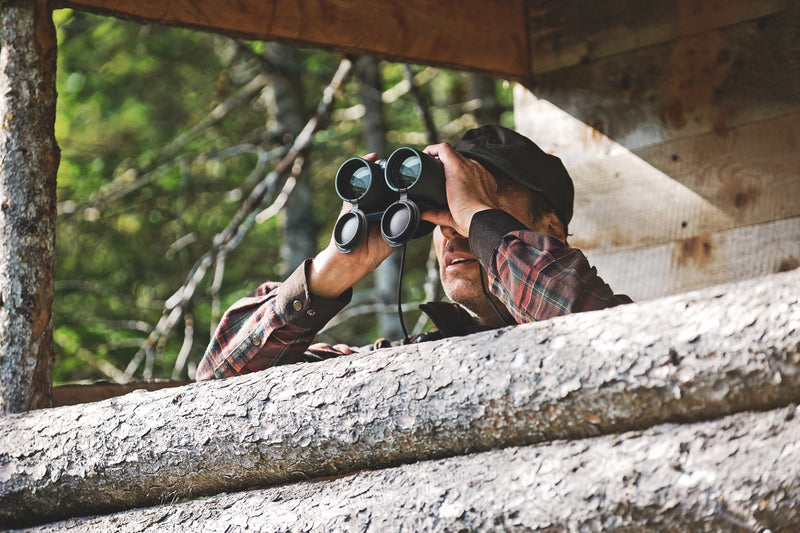 Man with binoculars from viewing platform