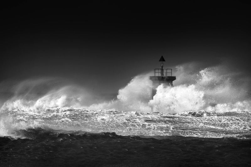 Stormy sea and lighthouse- black and white