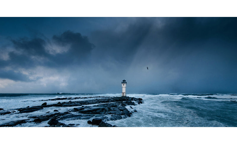 Lighthouse and stormy sky