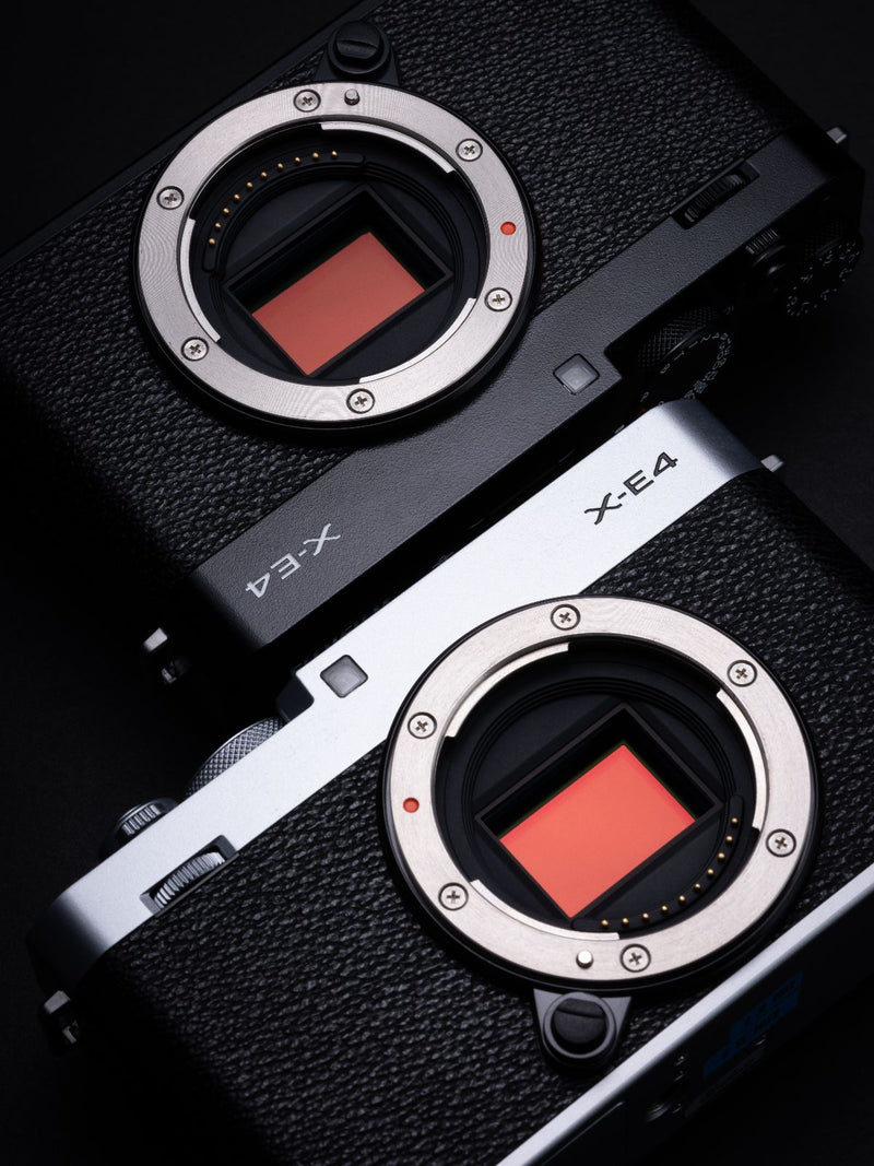 Fujifilm X-E4 Camera in black and black & silver without lenses